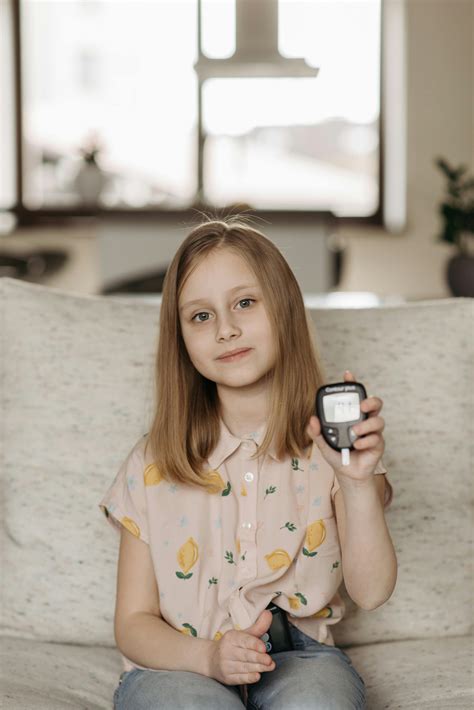 A Glucometer over Documents · Free Stock Photo