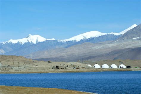 Karakul Lake - pure jewel among the harsh landscape of the surrounding ...