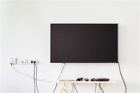 Fixer Tv Au Mur Sans Voir Les Fils Les Astuces