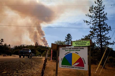 Merlin, Ore.: Above a river valley, rushing to keep fires from closing in