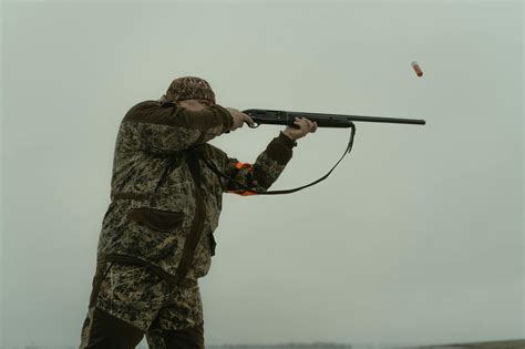 Photo Of A Man Firing His Shotgun · Free Stock Photo
