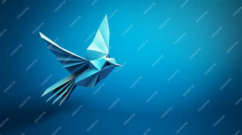 Premium Photo | Blue origami paper bird on blue