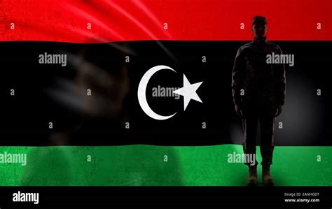 Libyan Soldier Silhouette Standing Against National Flag Proud Army