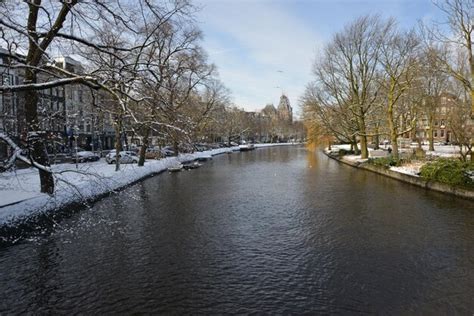 Premium Photo | Amsterdam winter snow canal amstel city center