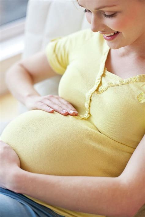 Pregnant Woman Touching Tummy Photograph By Ian Hooton Science Photo