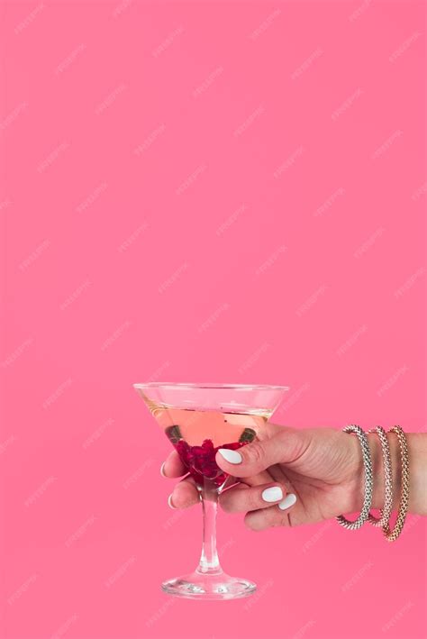 Free Photo Hand Holding Cocktail Glass With Copy Space