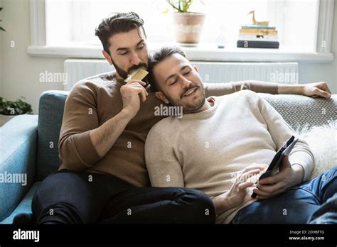 Gay Couple Relaxing On Sofa Hi Res Stock Photography And Images Alamy