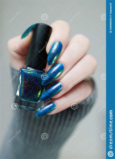 Beautiful Hand With Long Nails And Blue Green Manicure Stock Image