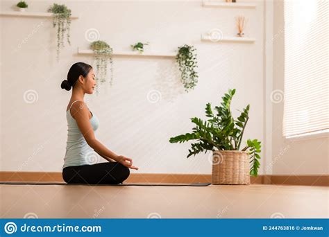 Calm Of Wellness Asian Young Woman Sit On Yoga Mat Doing Breathing With