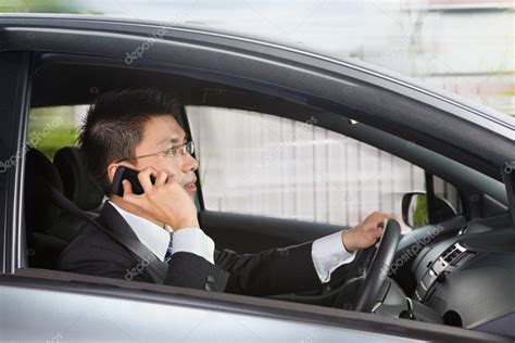 Talking on phone while driving Stock Photo by ©OtnaYdur 10741658