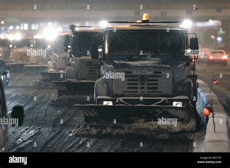 Snow clearing vehicles in action on Moscow s Krestovsky Bridge Stock ...