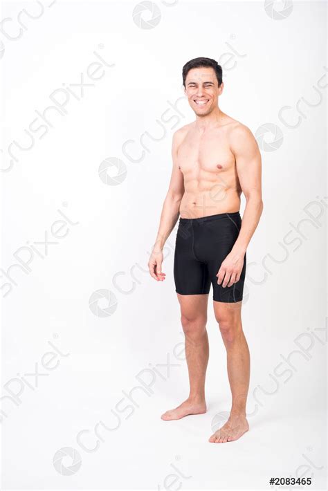 Shirtless Man Standing Looking At Camera Smiling Stock Photo