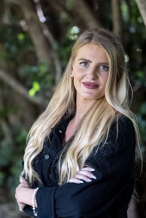 Blonde Beauty Glows In Autumn Sunlight Capturing A Perfect Moment Of Serenity And Radiance