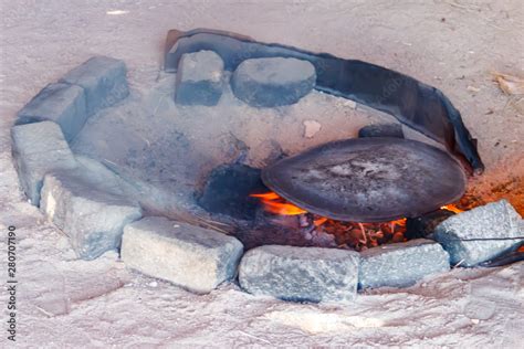 Traditional Metal Plate For Making Arabic Pita Bread Cooking On Fire In