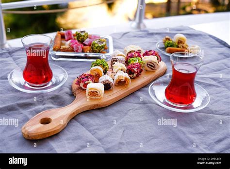 Traditional tea with lokum and muska, Turkish delight Stock Photo - Alamy