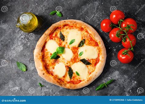 Italian Pizza Margherita With Mozzarella Cheese And Basil Leaves On