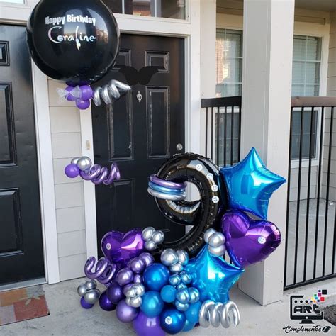 Balloons And Streamers Are On The Front Steps Of A House For A New Year