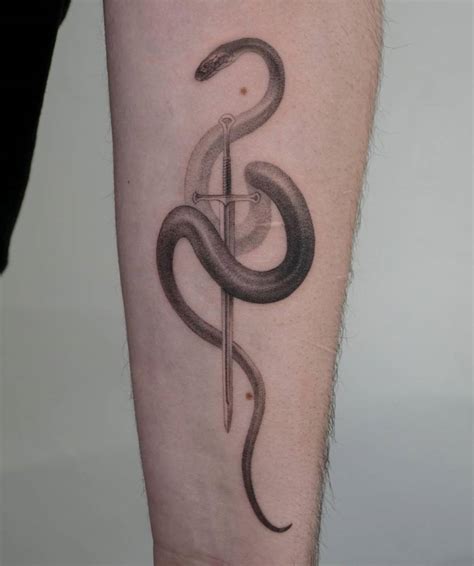 Single Needle Snake And Sword Tattoo On The Inner