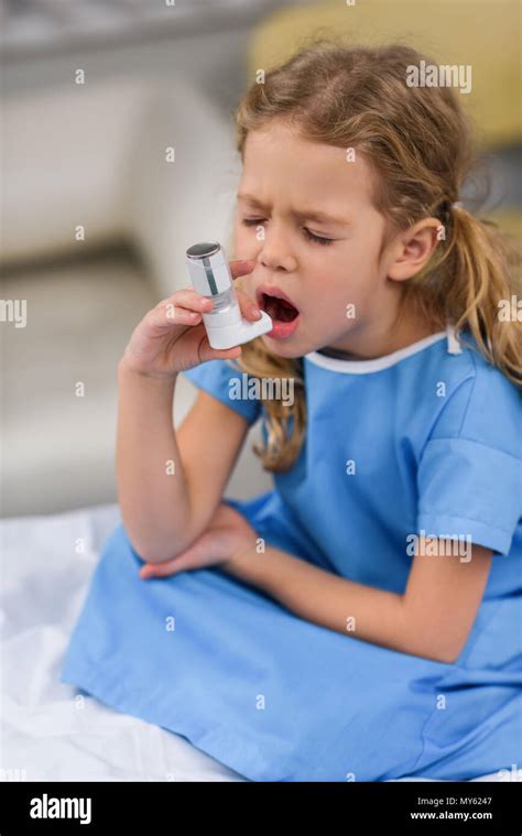 Ill Kid Using Asthma Inhaler With Closed Eyes Stock Photo Alamy