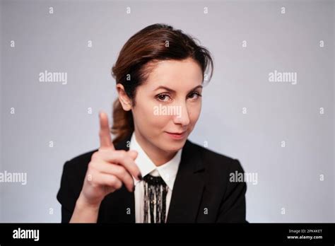 Emotional Brunette Caucasian Business Lady In Black Jacket Posing On Isolated Background