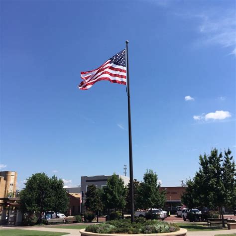 The American Flag Waves Proudly Over Celebration Plaza In Sulphur