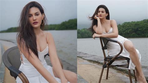 Amyra Dastur Looks Smoking Hot In White Thigh High Slit Glamorous Dress