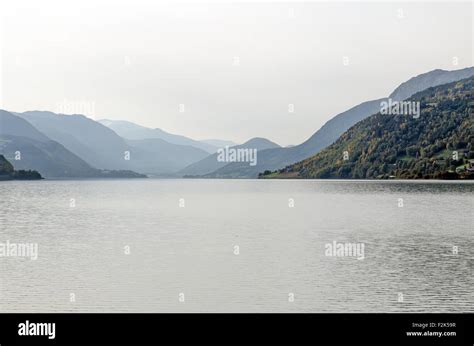 View of the misty mountain lake. Norway Stock Photo - Alamy