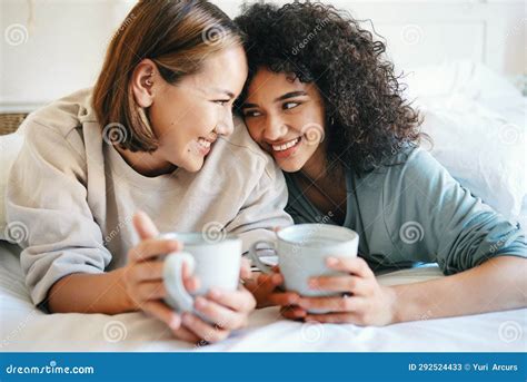 Coffee Love And Lesbian Couple On Bed In Conversation For Bonding And Relaxing Together Happy