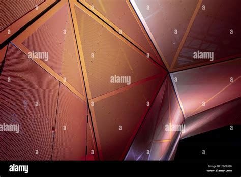 Orange And Red Geometric Metallic Construction From Triangular Parts