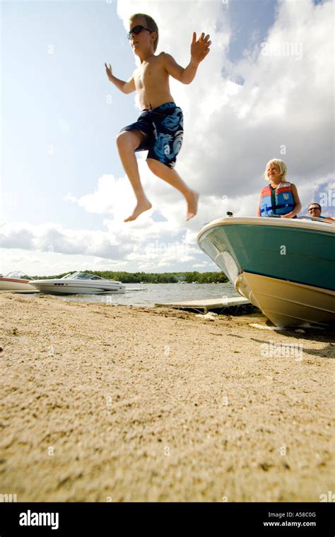 Boy Jumping Boat Stock Photos And Boy Jumping Boat Stock Images Alamy