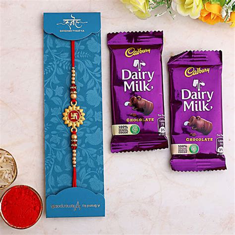 Buy Send Divine Swastika Rakhi And Dairy Milk Chocolates Online Fnp