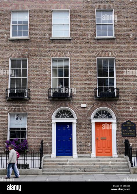 Orange And Blue Entrance Doors With Brick Facade Institute Of