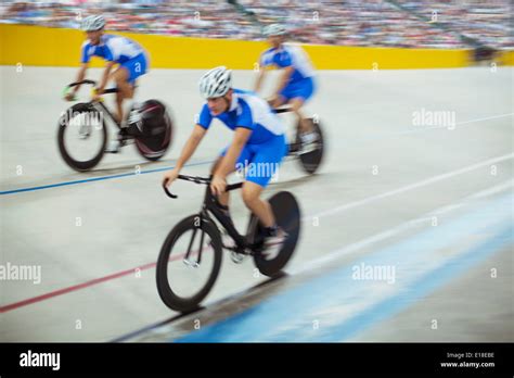 Track cycling team riding in velodrome Stock Photo - Alamy
