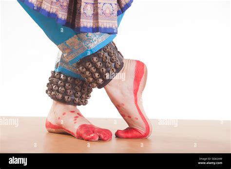 Traditional Dancers Feet Performing Bharatanatyam Over White