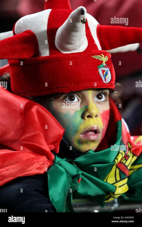 Portugal Fans Wearing Hats And Face Paint In The Stands Hi Res Stock