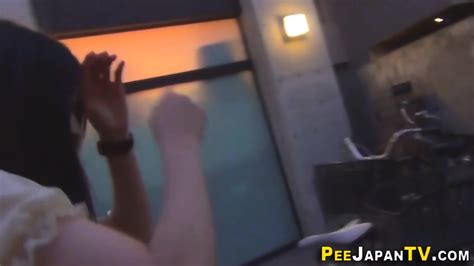 Clothed Japanese Babe Urinates