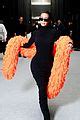 Kim Kardashian Accessorizes With A Bright Orange Feather Boa At