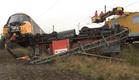 Suspected brake-failure causes a brand new train to overrun a dead end siding as it's being ...