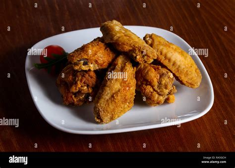 Chicken Wings Heap Served Cherry Tomato Stock Photo Alamy