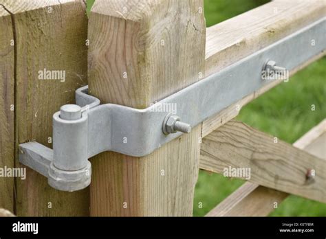 Close up of wooden gate hinge Stock Photo - Alamy