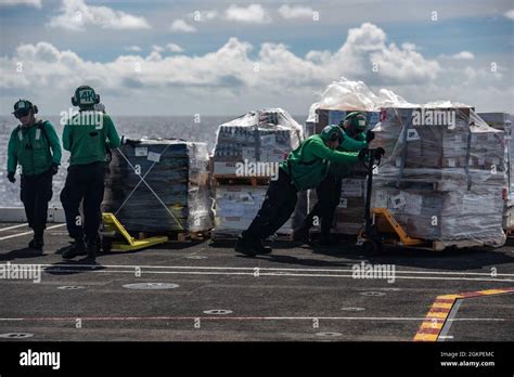 210613 N ML137 1141 PHILIPPINE SEA June 13 2021 Sailors Move Cargo