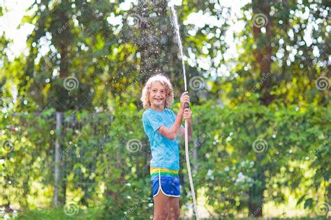 Kids Play With Water Sprinkle Hose Summer Garden Stock Photo Image