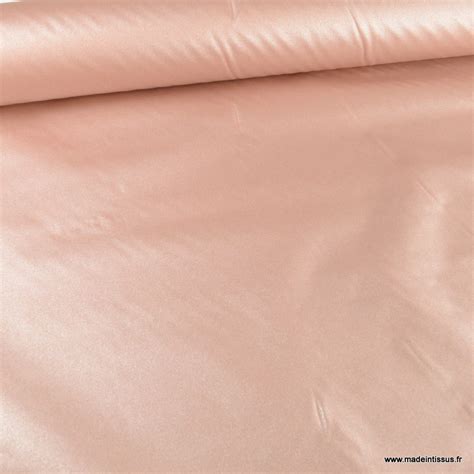 Tissu Enduit nacré uni rose poudre