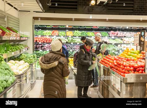 Shoppers In The Produce Department In The New Whole Foods Market Stock