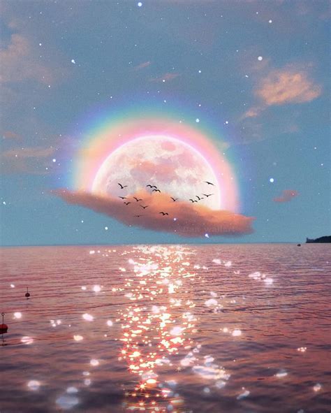 An Image Of A Rainbow In The Sky Over Water With Birds Flying Around