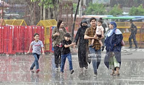 Visitors out on rain at Red Fort, on May 3, 2023 in New Delhi, India ...