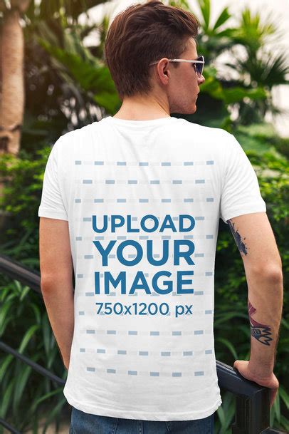 Placeit Back View T Shirt Mockup Featuring A Man In An Alley