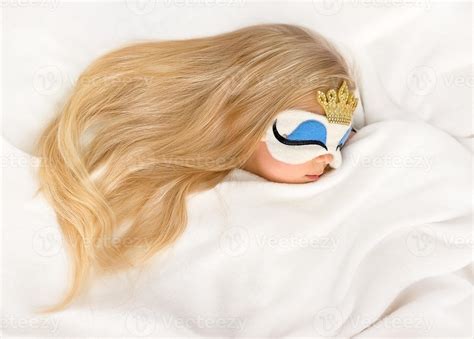 Cute Blonde Girl Sleeping Wearing Sleeping Princess Plush Mask Stock Photo At Vecteezy