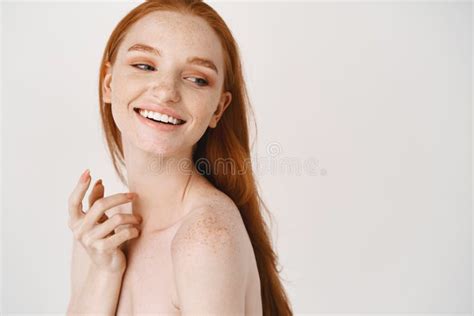 Close Up Of Pale Redhead Woman Standing Naked On White Background Turn Right And Smiling At