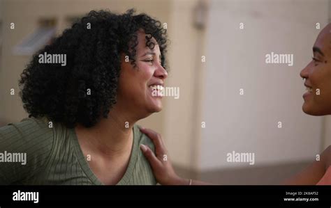 Two Happy Black Women In Conversation Standing Outdoors Girlfriends